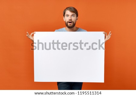 man holding white paper                     