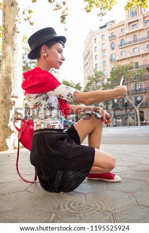 Tourism in Europe, Girl taking selfie self-portrait on smartphone on the street in Barcelona