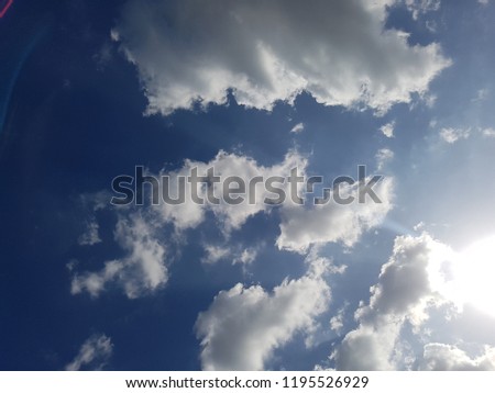 Sun Blue Sky look beautiful, pictures is taken of dark clouds on blue sky with Sunshine. Sun with white clouds on blue sky 