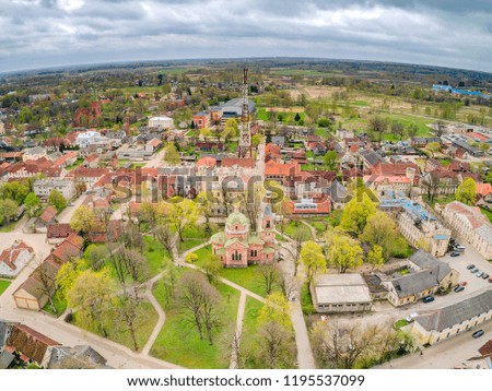 Kuldiga Orthodox Church with a park. Church of the Holy Virgin was built in 1871 and it has smallest parish in city. Dome frescos, as well as portraits of Holy Mary, Archangel Gabriel and evangelists