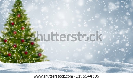 blurred christmas tree in snowy landscape, beautiful abstract winter background with snowflake as xmas concept Royalty-Free Stock Photo #1195544305