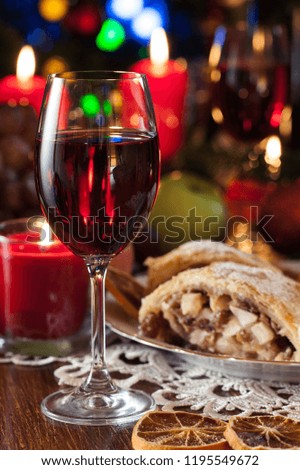Traditional puff pastry strudel with apple, raisins and cinnamon. Christmas table