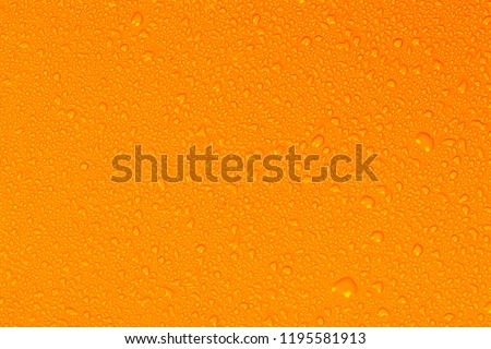Close up water drops on yellow tone background. Abstarct orange wet texture with bubbles on window glass surface. Raindrop, Realistic pure water droplets condensed for creative banner design, Hot