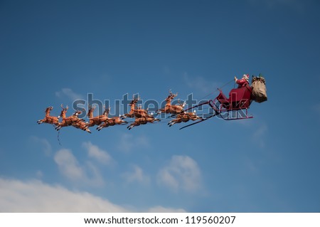 Santa's Sleigh flying above the city during Christmas