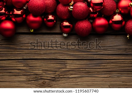 Christmas background with christmas ball, gift, red hat and snow on a wooden background/ Christmas background