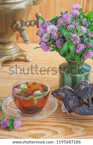 Delicious and healthy tea from birch mushroom chaga and clover flowers
