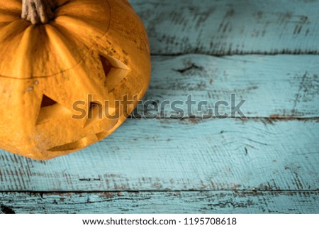 Halloween pumpkin on old wooden pastel background