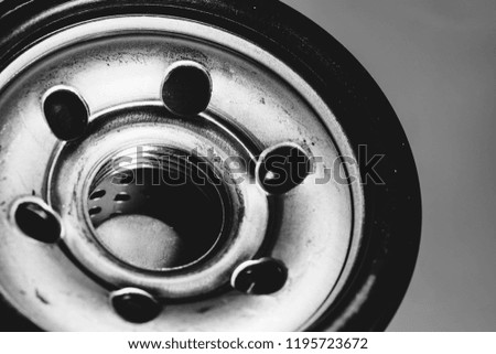 Monochrome background image of oil filter close up. Art macro photography of auto part in grayscale.