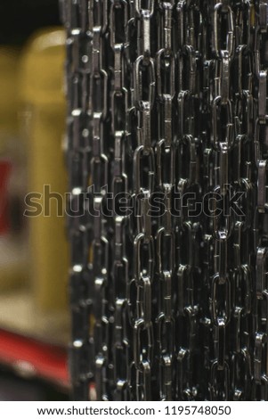 Photo of hanging metal chains.