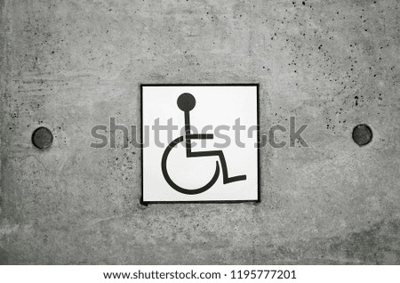 Handicapped Sign Way For Restroom in Building                                                                