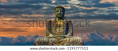 A Image of buddha with mountains at dawn background Royalty-Free Stock Photo #1195777513