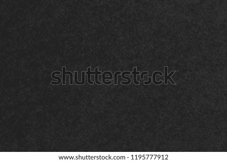 Black paper texture background.