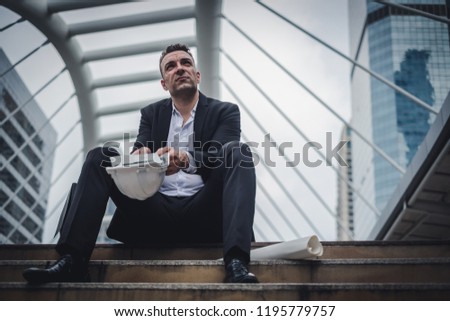 Portrait of business man stress sitting on stair, people unemployed, ideas for business failure and unemployment problem concept.