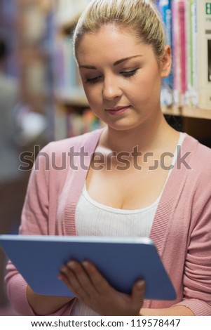 Woman holding tablet computer at the library