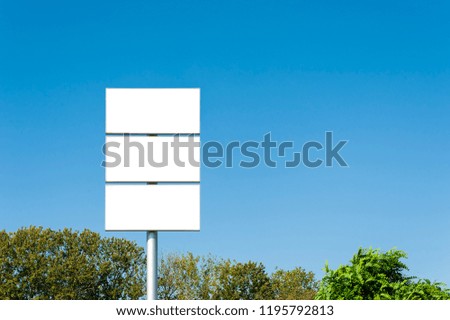 Blank banners in a top of the pole. Mock up for advertisement.