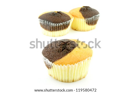 Three plain and chocolate muffins on a white background