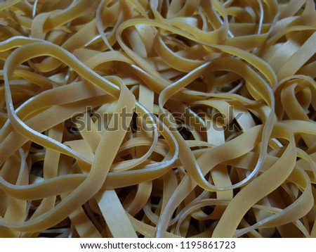 close up yellow rubber band background