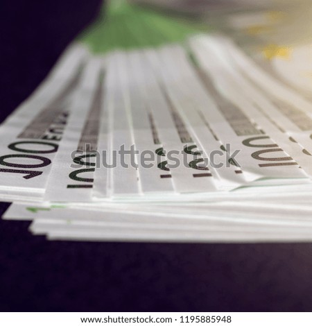 European euro currency bank notes lying on a desk close-up, symbolizing finance and business.