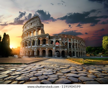 Sunlight on ancient ruins of Colosseum in Rome, Italy Royalty-Free Stock Photo #1195904599