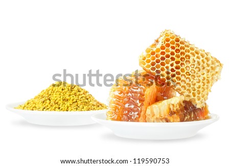 Honey honeycombs and pollen on plates on a white background