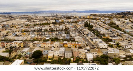 Multiple colors appear on the homes lined up next to the bay in San Francisco on the south side