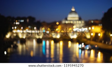 Lovely blurred view of the Saint Angel bridge across the Tiber River 