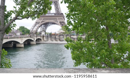In focus view of River Seine in Paris, France with Eiffel Tower in view