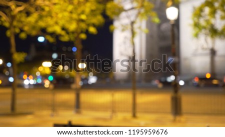 Blurry background of area by Arc de Trimphe in Paris at night for compositing