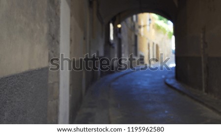 Out of focus backdrop of Italian city street with archway for compositing