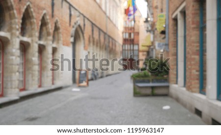Out of focus background plate of cobblestone alley in Europe for compositing
