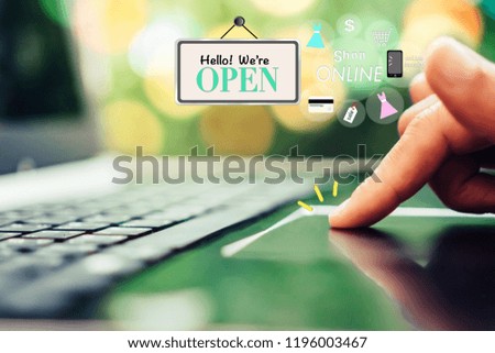 Women hand using laptop do online selling for people that shopping online with chat box, cart, dollar icons pop up. Social media maketing concept.