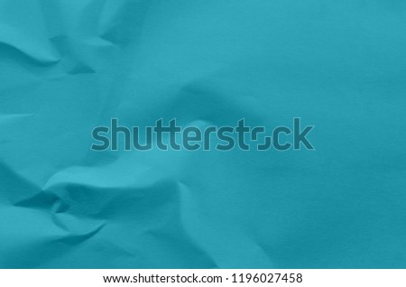 Blue background and wallpaper by crumpled paper, Blue crumpled paper texture with empty and free space for text, Background by scruffy paper texture and detail.