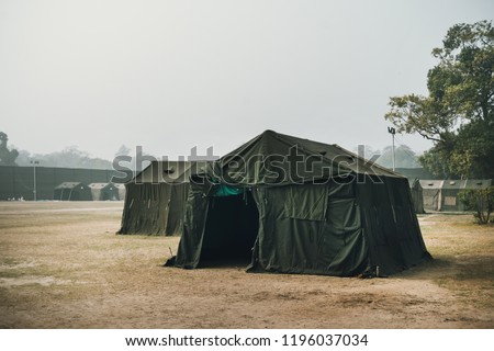 the Army military camp in the forest, nobody, anywhere in the world. a refugee camp on the border. Field of the barracks. Military field medicine. Field hospital. Pow camp. army base, installation