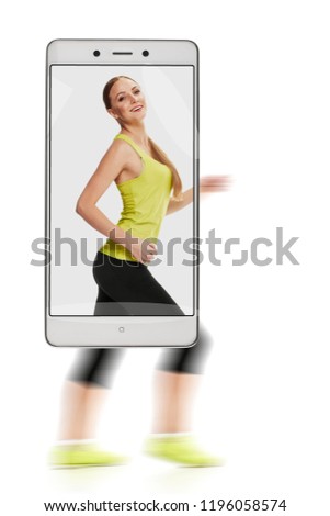 Pretty slim laughing woman in sportswear running race, concept of image quality. freezing moving objects in the camera smartphone