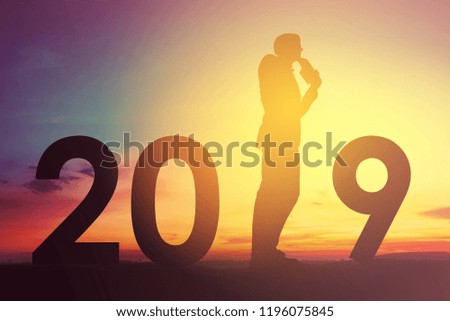 2019 happy new years christmas eve, Silhouette of a man is standing on thinking idea of new projects in outdoor
