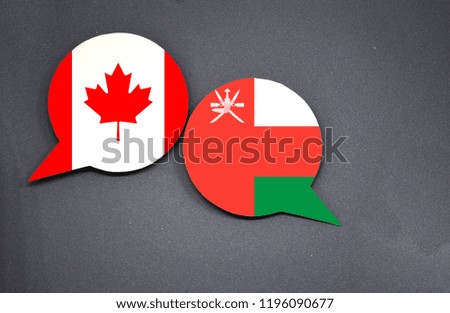 Canada and Oman flags with two speech bubbles on dark gray background