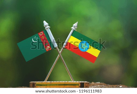 Ethiopia and Turkmenistan small flag with blur green background