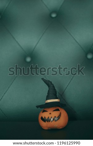 Halloween pumpkin on the sofa