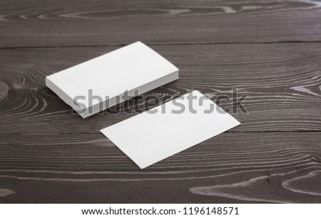 Mockup of business cards, Photo of business cards stack on a 
dark wood background