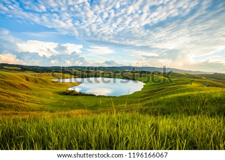 Imfote Lake, a beutiful landscape in Jayapura, Papua, Indonesia. The shape of the lake is look like a heart so that it is also called lake love. Royalty-Free Stock Photo #1196166067