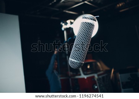 Sound engineer holding a microphone