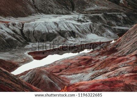 red copper pit with small people