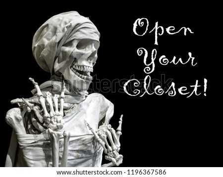 The skeleton model of the man with the inscription Open your closet.