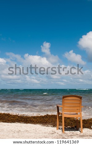singular chair at the beach in Vieux Fort, Saint Lucia (conceptual picture for vacations or retirement)