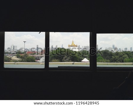 City view outside the window with Thai landmark. Wat Saket view, Bangkok Thailand