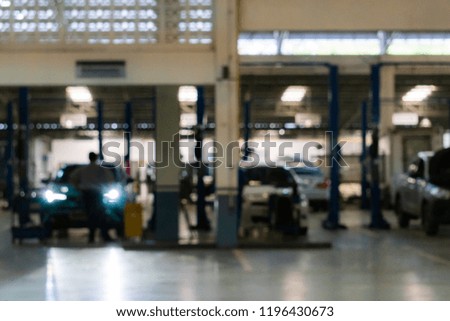 Blurred : Car repair technicians are standing in the service center. To perform a maintenance check.