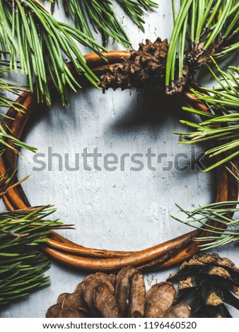 Pine branches, christmas winter mock up over wooden background. Greetings card new year mockup with christmas decoration. Christmas evergreen fir branches with pinecones flat lay top view mock-up.