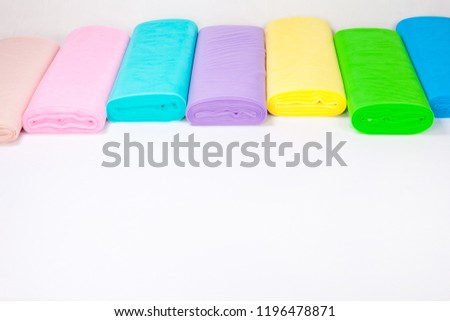 Colorful rolls of fabric are in stock - isolated on white background