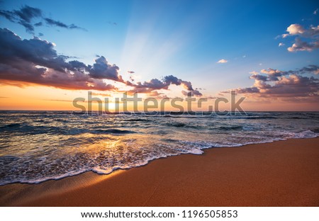 Colorful ocean beach sunrise. Royalty-Free Stock Photo #1196505853