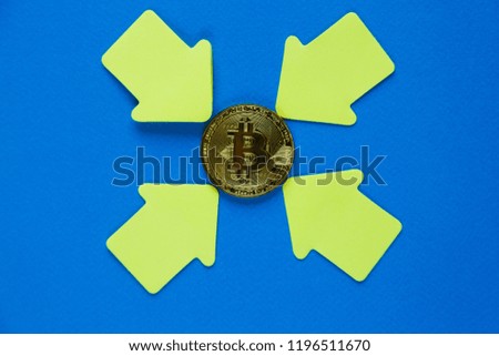 Golden bitcoin with yellow paper arrows on blue background. Internet security, risk, investment, business concept. Cryptocurrency digital payment concept, new money 